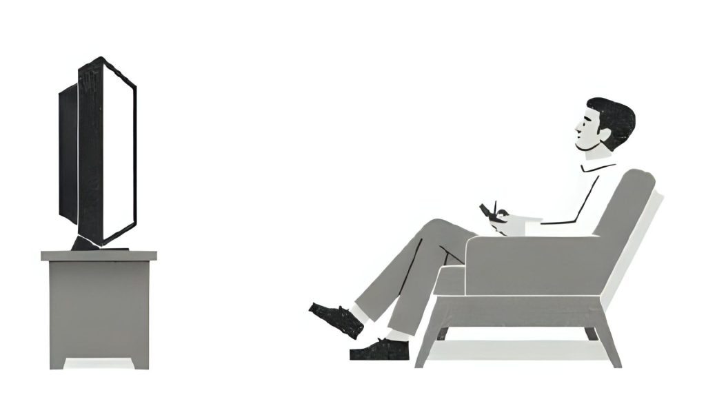 man watching television at home